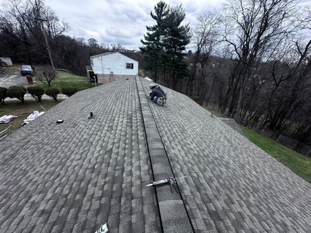 Skilled roofing contractor in Westmoreland County, PA replacing residential shingles